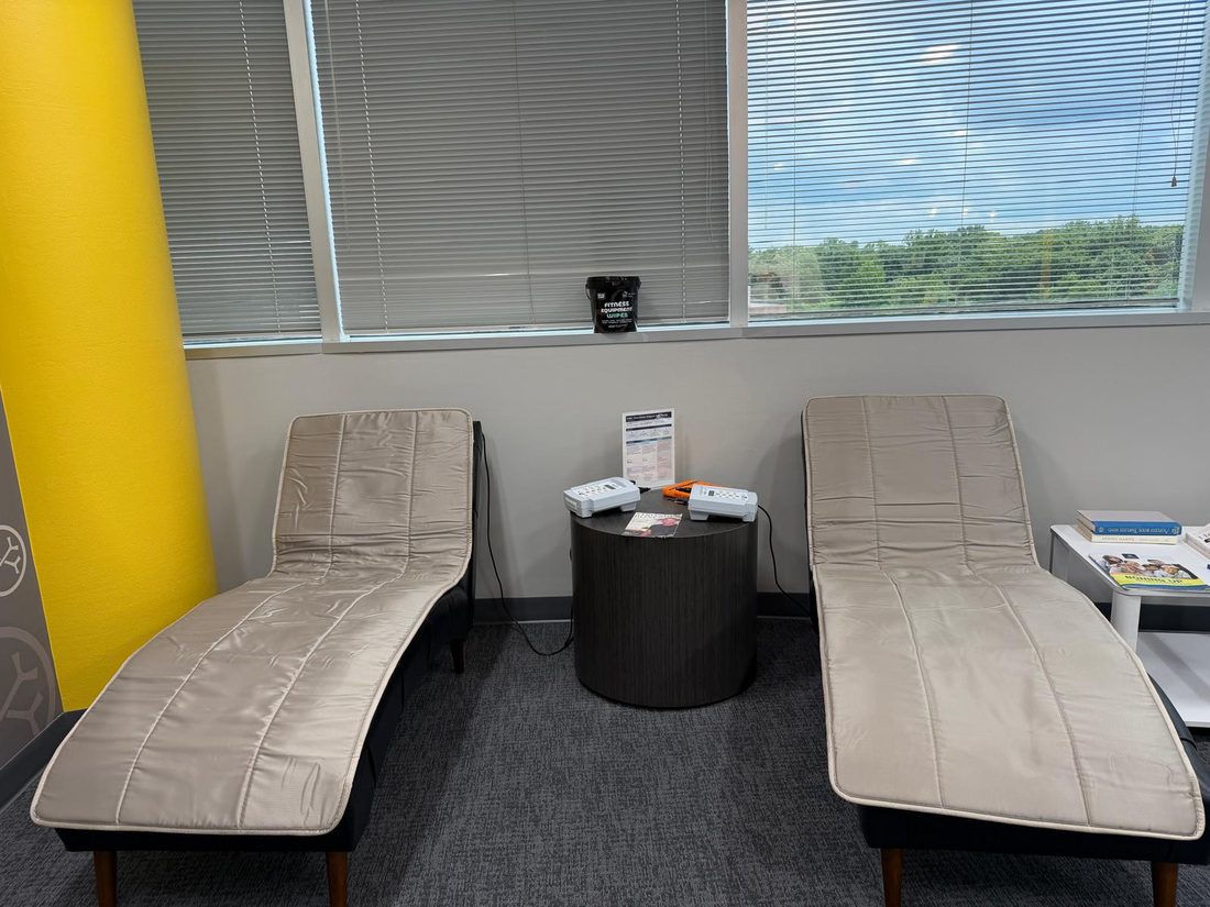 Two PureWave PEMF mats on loungers at OsteoStrong Tysons